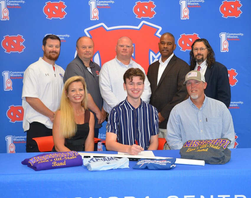 Neshoba Central’s Cole Freeman signed with Itawamba Community College to further his education and be a member of the band.  Pictured, front row from left, are his mother Ashley Freeman, Cole Freeman and his father Aaron Freeman (Back) Assistant Principal Jonathan Walker,  Principal Jason Gentry, Assistant Principal Brent Pouncy Assistant Principal LaShon Horne, and Band Director Daniel Wade.